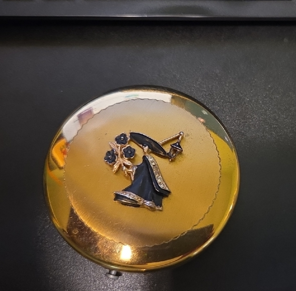 Elegant Gold and Black Compact Mirror
